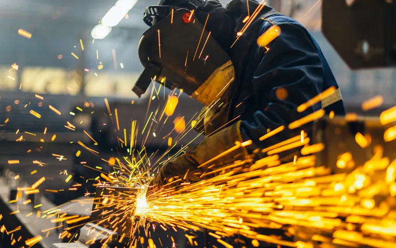 Man cutting an aluminium tube